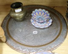 A Middle Eastern silvered copper tray, two bowls and a vase