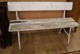 A small cast iron and wood garden bench W.125cm