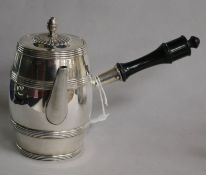 A silver chocolate pot, of barrel form with ebonised handle London 1901, Makers: Goldsmiths &