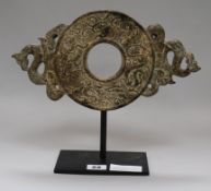A Chinese stone bi disc height 26cm width 30cm