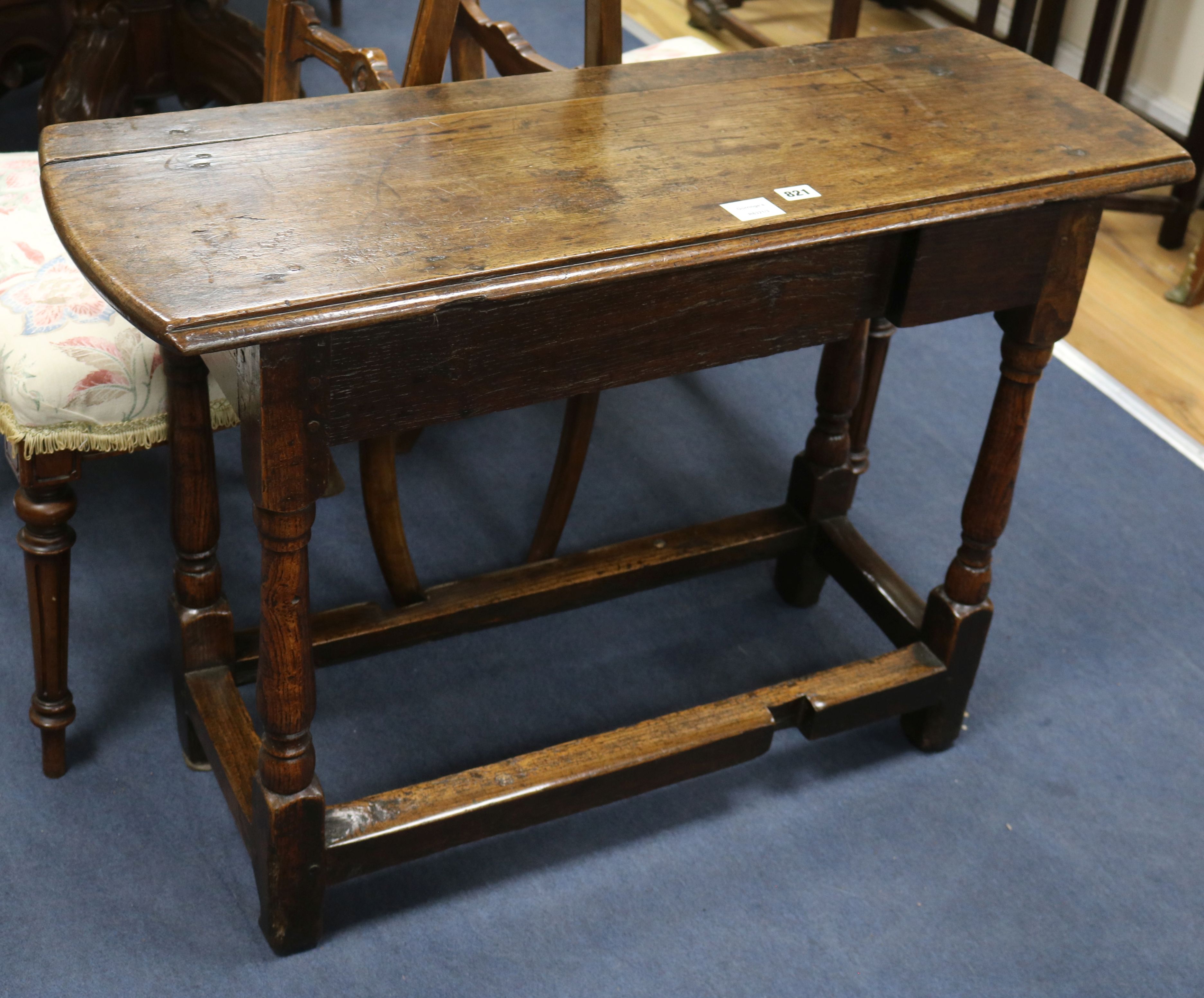 A late 17th century oak gateleg table (flaps deficient) W.95cm