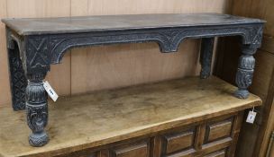 A Victorian carved oak bench W.117cm