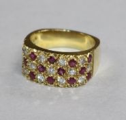 An 18ct gold, ruby and diamond pave set ring, size N.