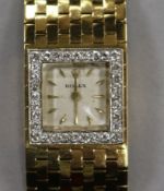 A lady's late 1950's 18ct gold and diamond set Rolex manual wind bracelet watch, retailed by