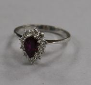 An 18ct gold ruby and diamond pear shaped cluster ring, size Q.