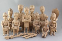 A set of eleven African carved wood figures of Ashanti courtiers, largest 32cm
