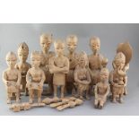 A set of eleven African carved wood figures of Ashanti courtiers, largest 32cm