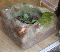 A circular stone trough