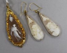 A yellow metal mounted pear shaped cameo pendant and a pair of yellow metal and cameo earrings.