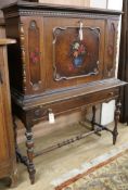 A painted and decorated secretaire cabinet W.102cm