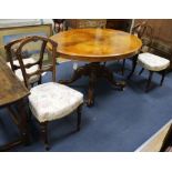 A Victorian walnut breakfast table and four Victorian walnut chairs W.135cm