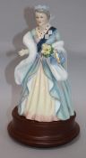 A Royal Doulton figure 'The Queen Mother' HN3189, boxed height 25cm