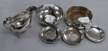 A silver bottle coaster, a silver sauceboat with lion mask and paw feet and four other items,