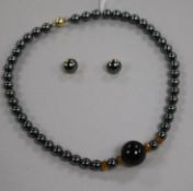 A hematite and hardstone necklace with 9ct clasp and a pair of 9ct gold and hematite earrings.