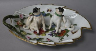Two 20th century Meissen pugs and a Meissen leaf dish