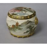 A Japanese Satsuma pottery drum shaped box and cover, Meiji period