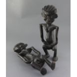 A pair of African ebonised wood fertility figures, 42cm