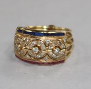 A Middle Eastern yellow metal multi shank ruby, diamond and sapphire 'puzzle' ring, size M.