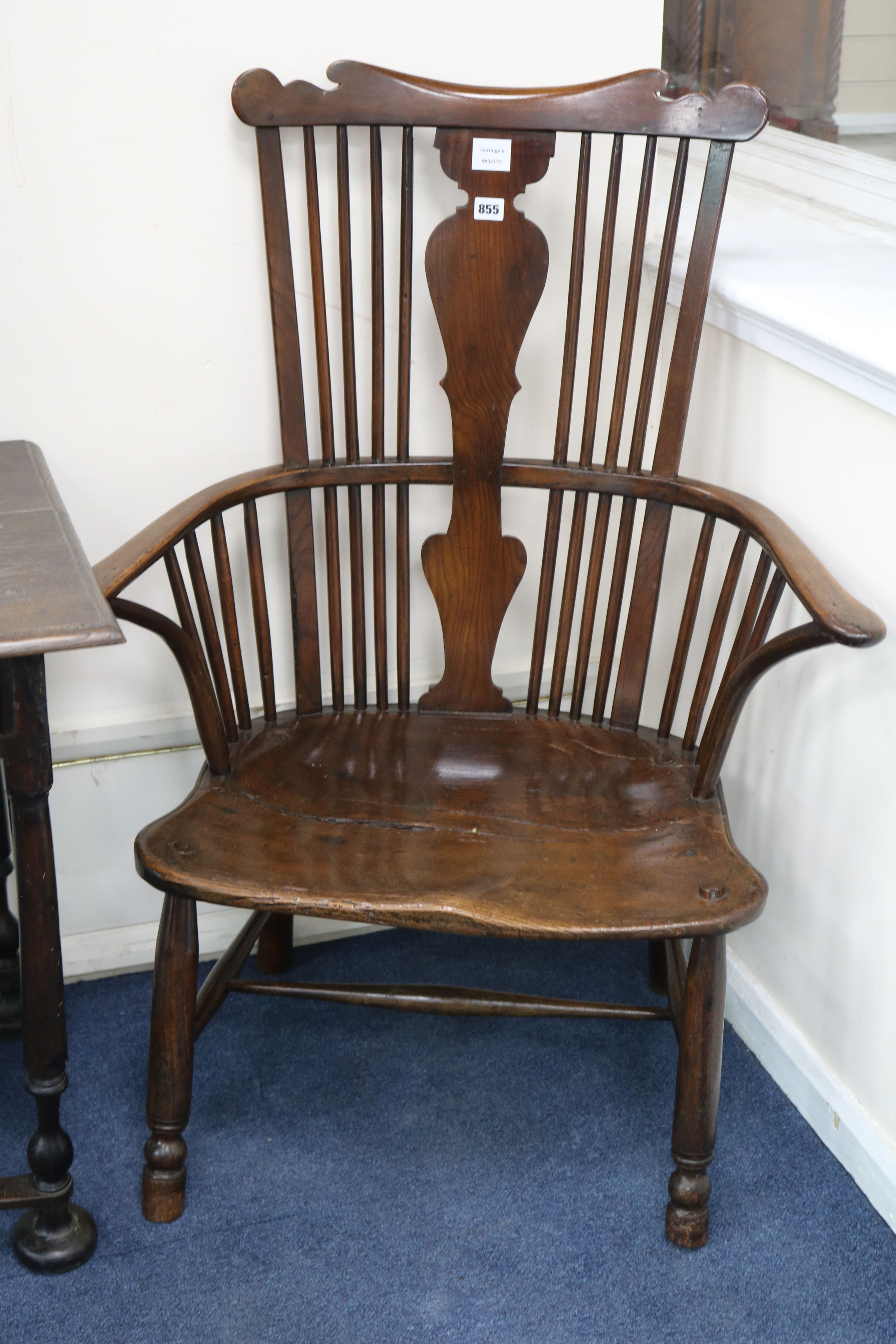 A mid 18th century "Thames Valley" elm, ash and beech comb back elbow chair