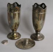 A pair of George V silver vases, Birmingham, 1922, a white metal model of a gaucho hat and a
