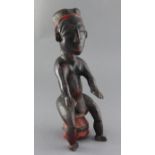 An Attye People Ivory Coast carved and painted hardwood seated shrine figure, height 38cm