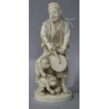 A Japanese carved figure with monkeys