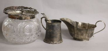 A silver mounted biscuit barrel, a silver mug, silver sauceboat and set of six Victorian silver