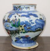 A large Chinese wucai jar, 19th century, painted in Transitional style with scholars seated at a