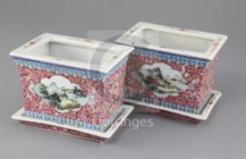 A pair of Chinese famille rose rectangular jardinieres and stands, 19th century, finely painted with