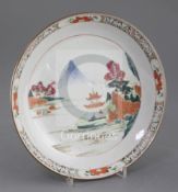 A Chinese famille rose 'landscape' saucer dish, early Qianlong period, painted with a pavilion in