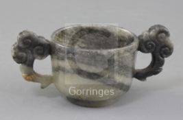 A Chinese grey and black speckled jade two handled cup, 17th/18th century, with a diaper and line