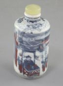 A Chinese underglaze blue and copper red cylindrical snuff bottle, 19th century, finely painted with