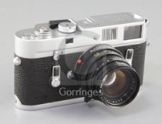 A Leica M4 Rangefinder camera, chrome, rare serial no. 331A with Leitz Summicron-M f/2 50mm lens,