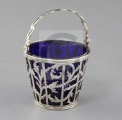 A George III pierced silver sugar basket with blue glass liner, Charles Chesterman II?, London,