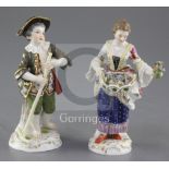 Two Meissen figures of gardeners, late 19th century, the first a boy holding a rake, the second a