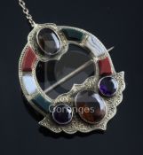 A Victorian engraved gold, Scottish hardstone and gem set brooch, with safety chain, 40mm.