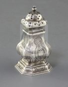 A George I Britannia standard silver pepper of square baluster form with engraved decoration, Edward