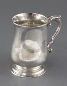A George III silver mug by Thomas Whipham & Charles Wright, with acanthus leaf capped scroll handle,