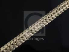 An early 1970's textured 9ct gold woven link bracelet, 19.4cm.