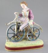 Early cycling interest: A French painted biscuit porcelain figure of a young man riding a bone