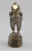 Peter Tereszczuk (1875-1963). A bronze and ivory figure of Pierrot, modelled standing with hands