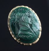 An oval malachite cameo brooch-cum-pendant carved in relief with the bust of a young woman, in 14K