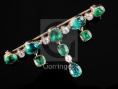 A 19th century gold, diamond and green paste drop bar brooch, set with five old mine cut diamonds,