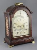 A late 18th century mahogany table clock, unsigned, with break arch case and painted Roman dial with