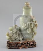 A Chinese celadon jade vase, 20th century, carved in high relief and openwork with prunus,