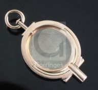 A Victorian gold mounted and chalcedony spinning fob seal, the matrix carved with shield crest and