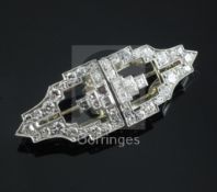 An Art Deco style white gold and diamond double clip brooch, of stepped tapering design, set with