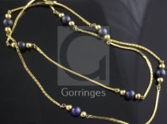 An Italian 18ct gold and lapis lazuli bead necklace, set with seven beads with spherical spacers,