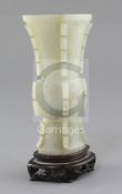 A Chinese archaistic pale celadon jade beaker vase, gu, Qianlong / Jiaqing period (late 18th / early