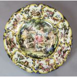 A large Italian maiolica charger, decorated with a stag hunting scene, label inscribed 'bought at